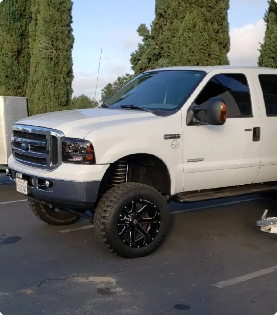 a white truck parked in a parking lot